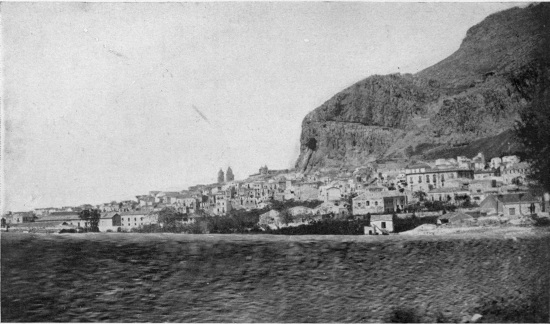 Cefalù, across the fields from a car-window of the fast Palermo express.