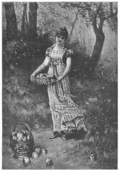 A young woman in woodlands, collecting apples
