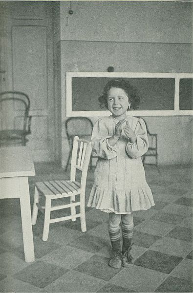 girl standing and clapping 