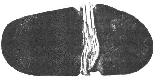 Full-grooved ax with fragment of hafting material. Length, 7″; Maximum width, 3½″; Width at groove, 2¾″.