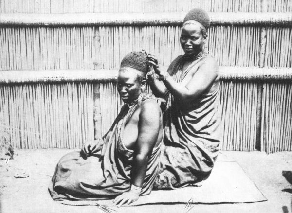 YOUNG PRINCESSES AMIABLY ENGAGED IN HAIR-DRESSING 