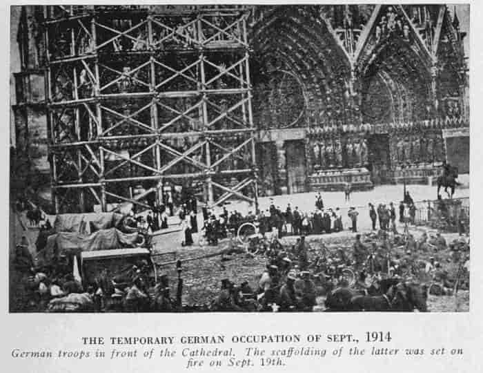 THE TEMPORARY GERMAN OCCUPATION OF SEPT. 1914 German troops in front of the Cathedral. The scaffolding of the latter was set on fire on Sept. 19.