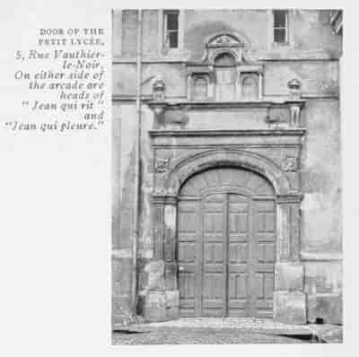 DOOR OF THE PETIT LYCÉE, 5, Rue Vauthier-le-Noir. On either side of the arcade are heads of "Jean qui rit" and "Jean qui pleure."