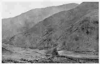 Fig. 46—Hacienda Huadquiña in the Salcantay Valley a short distance above its junction with the Urubamba, elevation 8,000 feet (2,440 m.). The cultivated fields are all planted to sugar cane. The mountain slopes are devoted to grazing.