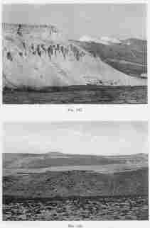 Fig. 132—Recessed volcanoes in the right background and eroded tuffs, ash beds, and lava flows on the left. Maritime Cordillera above Cotahuasi.