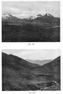 Fig. 188—Asymmetrical peaks in the Central Ranges between Antabamba and Lambrama. The snow-filled hollows in the photograph face away from the sun—that is, south—and have retained snow since the glacial epoch; while the northern slopes are snow-free. There is no true glacial ice and the continued cirque recession is due to nivation.