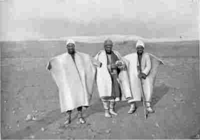 Author's Camel Men in their White Felt Coats.