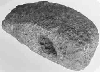 Hammer Head, found near the Wong, length 6⅝-in., width 3⅞-in. weight 3½-lb.; of porphyry from the Cheviot region, Neolithic period. The stone was probably part of a large boulder