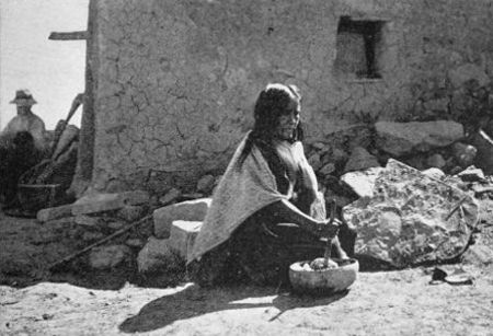 Hopi Woman preparing Corn Meal for making Doughnuts.