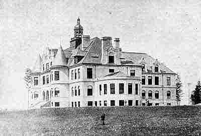 Denny Hall, a four story Richardsonian Romanesque building resembling a French chateau.