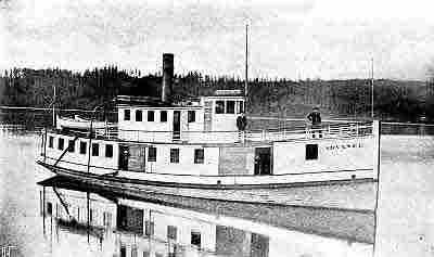 Small one level steamship with pilot house; two life boats and two men on pilot level deck. 